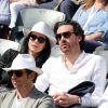 Marie Drucker et son compagnon Mathias Vicherat (directeur de cabinet d'Anne Hidalgo) dans les tribunes des Internationaux de France de tennis de Roland Garros à Paris le 30 mai 2015.