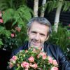 Lambert Wilson baptise la rose qui porte son nom lors de la manifestation "Jardin Jardin" aux Tuileries à Paris, le 3 juin 2015.