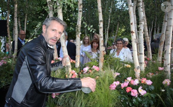 Lambert Wilson baptise la rose qui porte son nom lors d'une soirée organisée par Truffaut aux Tuileries à Paris, le 3 juin 2015.03/06/2015 - Paris