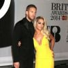 Rita Ora et son petit-ami Calvin Harris - Personnalités arrivant à la soirée des "Brit Awards 2014" en partenariat avec MasterCard à Londres, le 19 février 2014.  