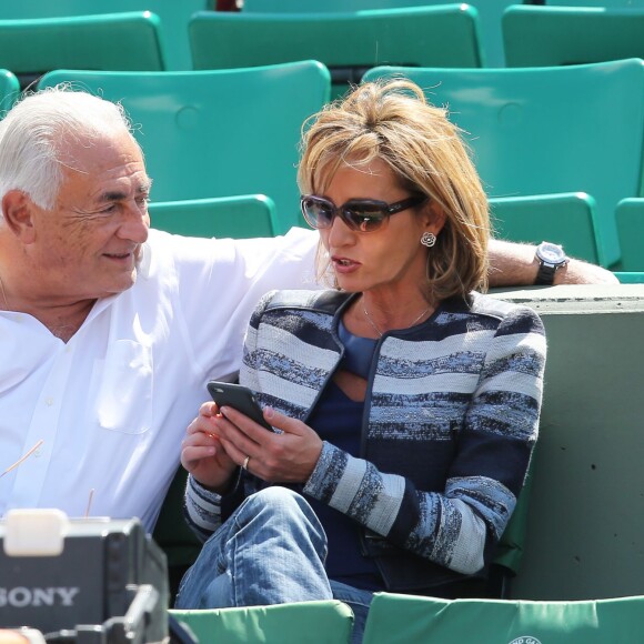Dominique Strauss Kahn et sa compagne Myriam L'Aouffir dans les tribunes des Internationaux de France de tennis de Roland Garros le 30 mai 2015 à Paris