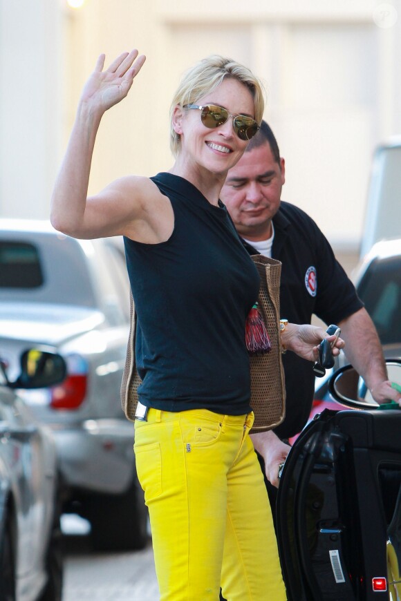 Sharon Stone exits Barneys with a smile in Beverley Hills, Los Angeles, CA, USA on June 24, 2015. The actress waved at the cameras as she returned to her car at the valet in bright yellow skinnies and heels. Photo by GSI/ABACAPRESS.COM25/06/2015 - Los Angeles