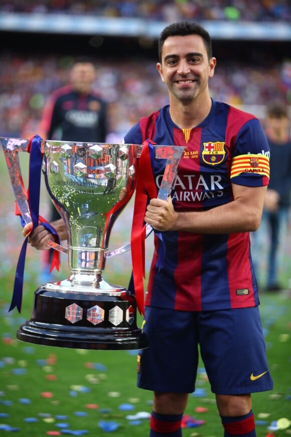 Xavi Hernandez - Les joueurs célèbrent leur victoire en Liga à Barcelone le 23 mai 2015