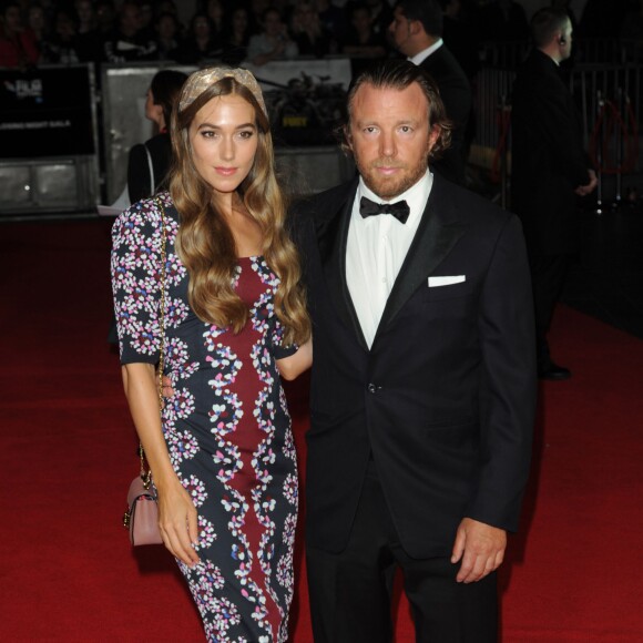 Guy Ritchie et sa fiancée Jacqui Ainsley - Arrivée des people à la première du film "Fury" lors de la cérémonie de clôture du 58e BFI London Film Festival à Londres, le 19 octobre 2014.