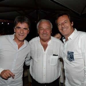 Exclusif - Tex (Jean-Christophe Le Texier), Marcel Campion et Jean-Luc Reichmann - Soirée Marcel Campion à la plage La Bouillabaisse à Saint-Tropez, le 5 août 2015.