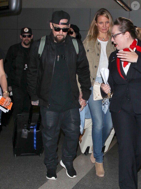 Cameron Diaz et son mari Benji Madden lors de leur arrivée à l'aéroport LAX de Los Angeles, le 31 août 2015