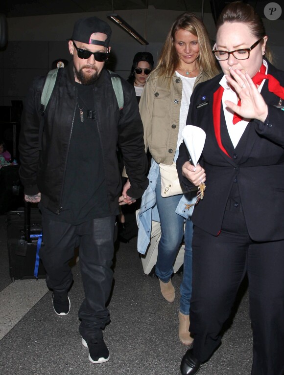 Cameron Diaz et son mari Benji Madden lors de leur arrivée à l'aéroport LAX de Los Angeles, le 31 août 2015