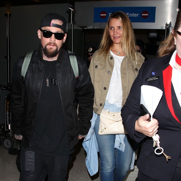 Cameron Diaz et son mari Benji Madden lors de leur arrivée à l'aéroport LAX de Los Angeles, le 31 août 2015