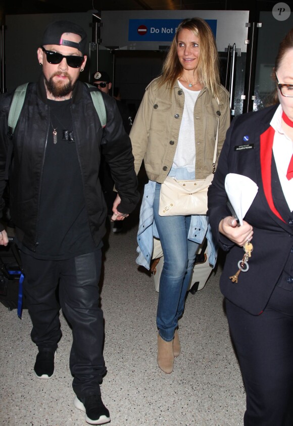 Cameron Diaz et son mari Benji Madden lors de leur arrivée à l'aéroport LAX de Los Angeles, le 31 août 2015
