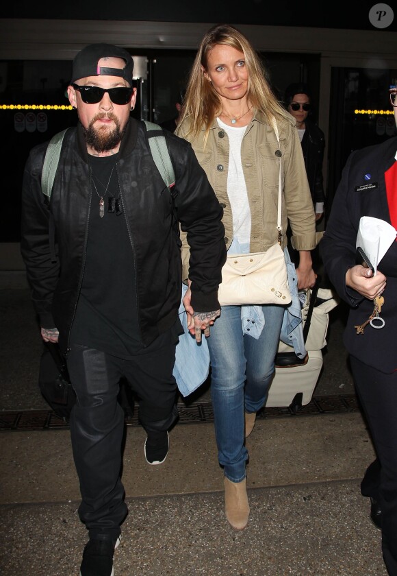 Cameron Diaz et son mari Benji Madden lors de leur arrivée à l'aéroport LAX de Los Angeles, le 31 août 2015