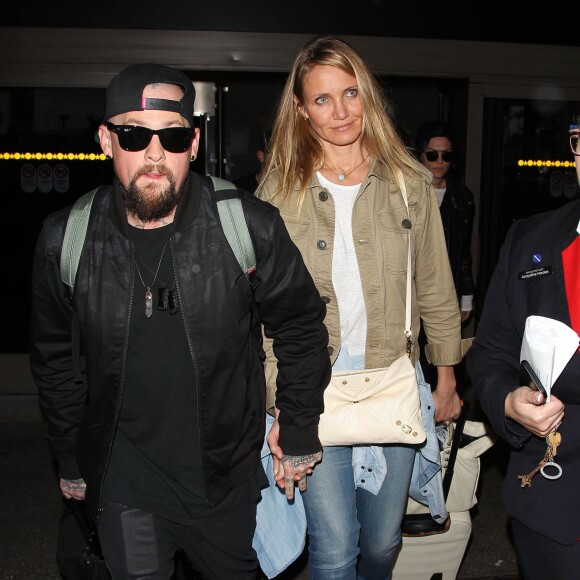 Cameron Diaz et son mari Benji Madden lors de leur arrivée à l'aéroport LAX de Los Angeles, le 31 août 2015