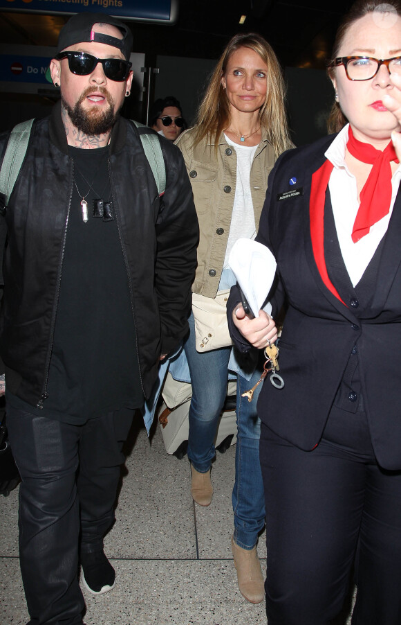 Cameron Diaz et son mari Benji Madden lors de leur arrivée à l'aéroport LAX de Los Angeles, le 31 août 2015