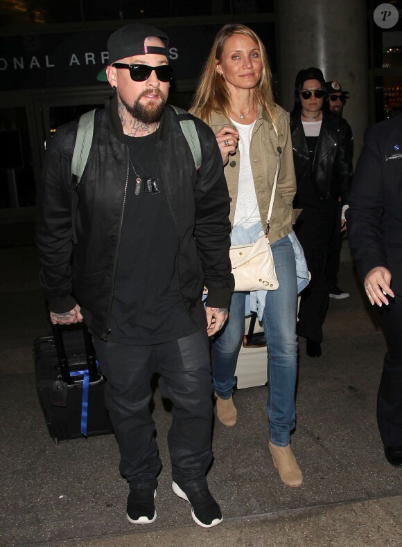 Cameron Diaz et son mari Benji Madden lors de leur arrivée à l'aéroport LAX de Los Angeles, le 31 août 2015