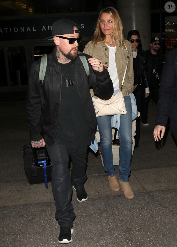 Cameron Diaz et son mari Benji Madden lors de leur arrivée à l'aéroport LAX de Los Angeles, le 31 août 2015
