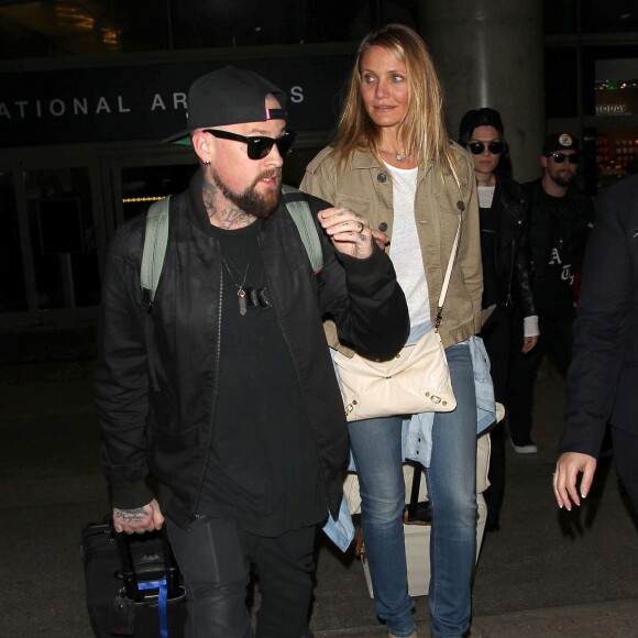 Cameron Diaz et son mari Benji Madden lors de leur arrivée à l'aéroport LAX de Los Angeles, le 31 août 2015