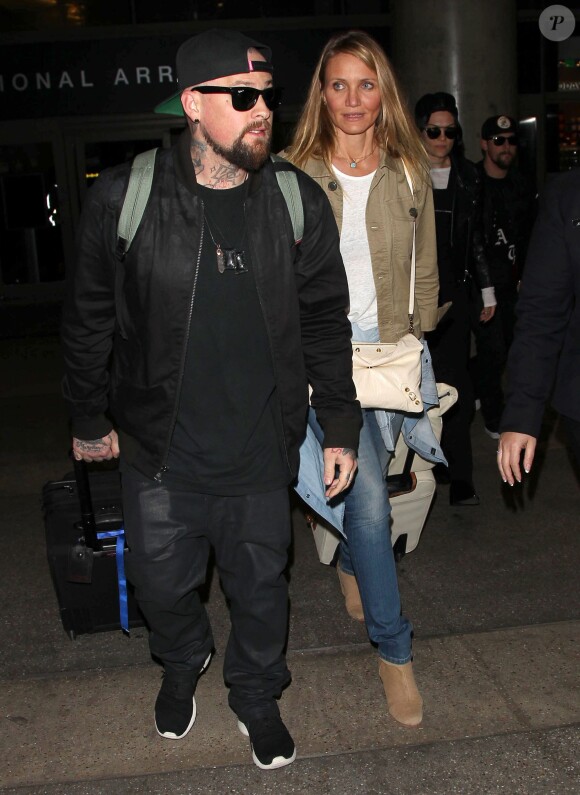 Cameron Diaz et son mari Benji Madden lors de leur arrivée à l'aéroport LAX de Los Angeles, le 31 août 2015