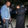 Kim Kardashian, enceinte, son mari Kanye West et leur fille North à l'aéroport LAX de Los Angeles. Le 5 septembre 2015.