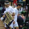 Sergiy Stakhovsky croise Roger Federer au second tour du tournoi de Wimbledon au All England Lawn Tennis and Croquet Club de Londres, le 26 juin 2013
