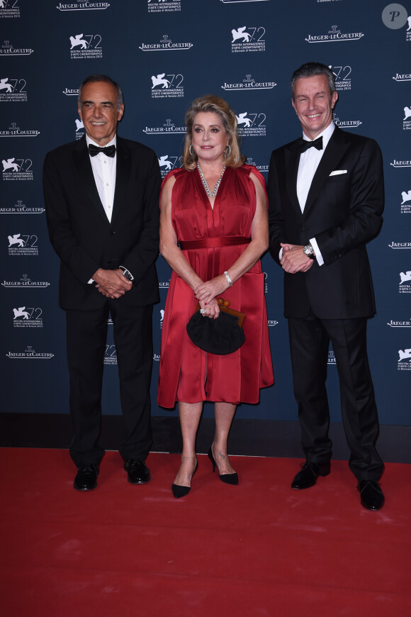 Alberto Barbera, Catherine Deneuve et Daniel Riedo (PDG de Jaeger-LeCoultre) assistent à la soirée Jaeger-LeCoultre en marge de la 72e Mostra de Venise, à l'hôtel Excelsior. Venise, le 7 septembre 2015.
