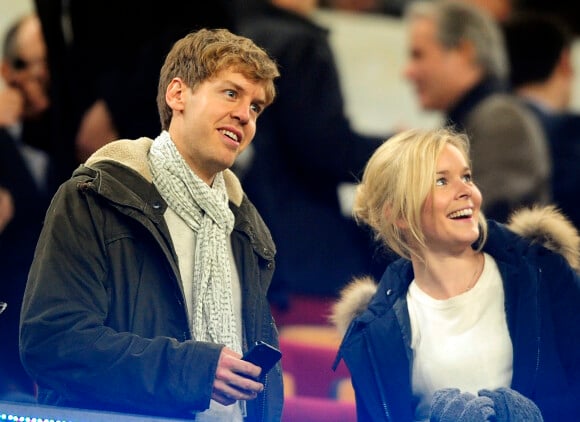 Sebastian Vettel et sa compagne Hanna lors de la rencontre entre le FC Barcelone et Valence, à Barcelone le 19 février 2012