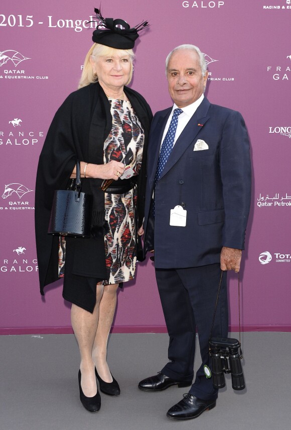 Yves Saint-Martin et sa femme - Photocall du 94ème Qatar Prix de l'Arc de Triomphe à l'Hippodrome de Longchamp à Paris, le 4 octobre 2015.