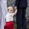 Le prince George de Cambridge lors du baptême de la princesse Charlotte de Cambridge à l'église St. Mary Magdalene à Sandringham, le 5 juillet 2015.