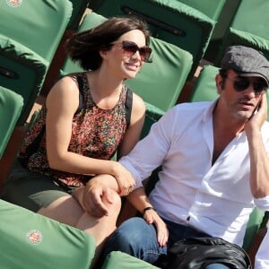 Jean Dujardin et sa compagne Nathalie Péchalat - People dans les tribunes lors de la finale des Internationaux de tennis de Roland-Garros à Paris, le 7 juin 2015. MERCI DE FLOUTER LA TETE DES ENFANTS AVANT PUBLICATION  PLEASE HIDE CHILDREN'S FACE PRIOR TO THE PUBLICATION People attending the final match during the 2015 French Open at Roland-Garros in Paris, France, on June 7th 2015.07/06/2015 - Paris