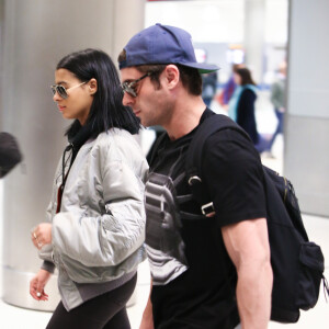 Exclusif - Zac Efron et sa compagne Sami Miro arrivent ensemble à Miami, le 21 février 2016.