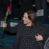 Semi-exclusif - Nathalie Péchalat enceinte reçoit une rose lors de l'avant première du film "Un + Une" de Claude Lelouch à l'UGC Normandie à Paris e 23 novembre 2015.