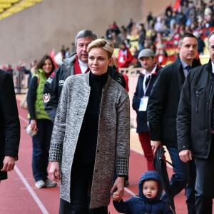 La princesse Charlene de Monaco assiste, en compagnie de son fils le prince héritier Jacques, au 6ème "Tournoi Sainte Dévote" de Rugby, le 27 février 2016, au Stade Louis II à Monaco. © Bruno Bebert / Bestimage