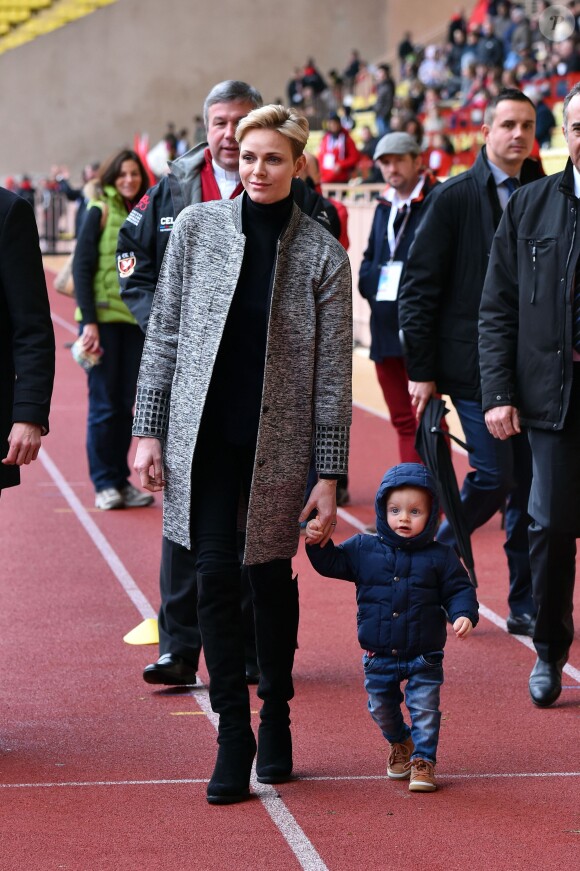 La princesse Charlene de Monaco assiste, en compagnie de son fils le prince héritier Jacques, au 6ème "Tournoi Sainte Dévote" de Rugby, le 27 février 2016, au Stade Louis II à Monaco. © Bruno Bebert / Bestimage