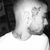 Zayn Malik s'est rasé la tête et offert trois nouveaux tatouages. photo publiée sur Instagram au mois de mars 2016.