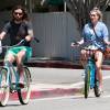 Exclusif - Kesha et son compagnon Brad Ashenfelter se baladent à vélo à Los Angeles le 1er mai 2016. © CPA / Bestimage