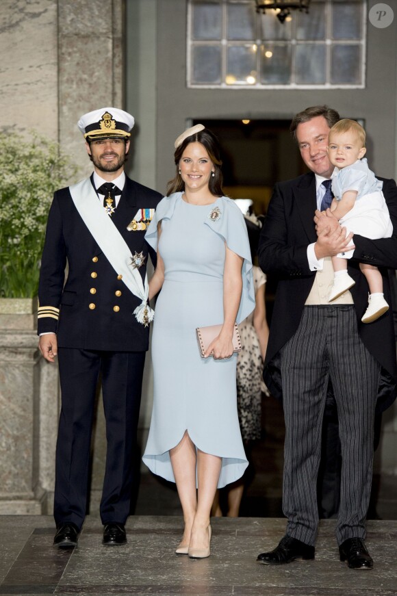 Le prince Carl Philip et la princesse Sofia (Hellqvist), Chris O'Neill et son fils le prince Nicolas - Baptême du prince Oscar de Suède à Stockholm en Suède le 27 mai 2016.