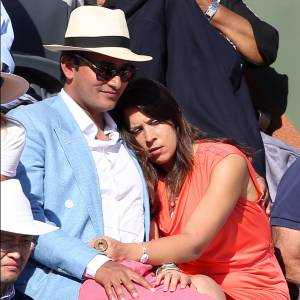Marion Bartoli et son compagnon dans les tribunes lors de la finale des Internationaux de tennis de Roland-Garros à Paris, le 7 juin 2015.