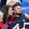 Olivier Giroud et sa compagne Jennifer - Les joueurs retrouvent leur famille dans les tribunes à la fin du match de quart de finale de l'UEFA Euro 2016 France-Islande au Stade de France à Saint-Denis le 3 juillet 2016. © Cyril Moreau / Bestimage