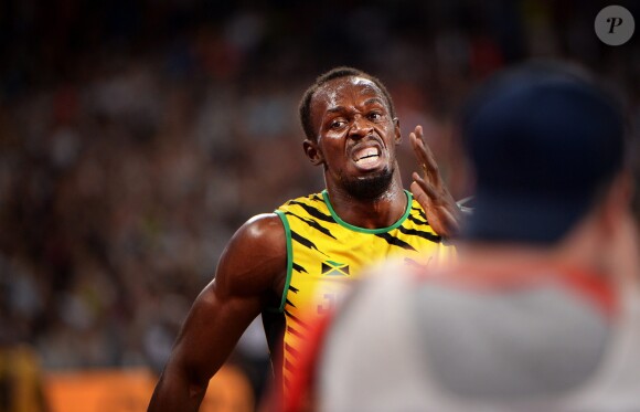 Usain Bolt et ses co-équipiers deviennent champions du monde en remportant le relais 4x100 lors du championnats du monde d'athlétisme à Pékin, le 29 août 2015.  Usain Bolt, Jamaica wins 4x100m during 15th IAAF World Athletics Championships Beijing 2015 Peking 2015 in Beijing on August 29, 2015.29/08/2015 - Pekin