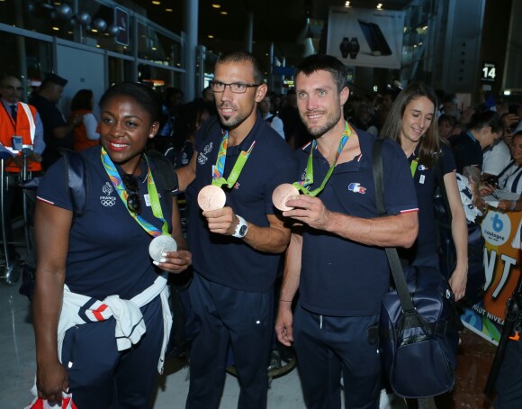 Gwladys Épangue, Guillaume Raineau et Franck Solforosi - Retour à Paris des athlètes français des Jeux olympiques de Rio 2016 à l'aéroport de Roissy le 23 août 2016.