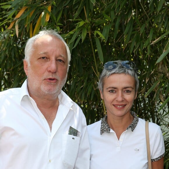 François Berléand et sa compagne, Alexia Stresi - People au village des Internationaux de France de tennis de Roland Garros à Paris, le 31 mai  2014.