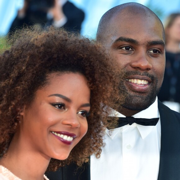 Teddy Riner et sa compagne Luthna participent à la montée des marches du film "Elle" lors du 69ème Festival International du Film de Cannes, le 21 mai 2016.