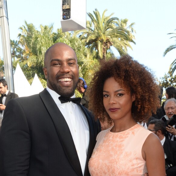 Teddy Riner et sa compagne Luthna participent à la montée des marches du film "Elle" lors du 69ème Festival International du Film de Cannes, le 21 mai 2016.