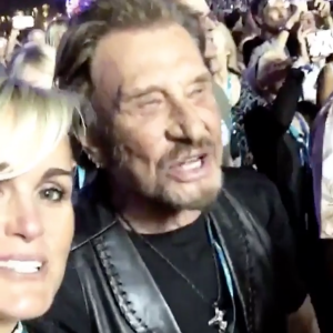 Johnny et Laeticia Hallyday chantent à tue-tête durant le concert des Rolling Stones à Indio, le 14 octobre 2016. (Capture d'écran d'une vidéo postée sur Instagram)