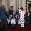 Le prince Harry, Kate Middleton et le prince William lors d'une réception en l'honneur des médaillés des Jeux olympiques et paralympiques de Rio 2016 au Palais de Buckingham à Londres le 18 octobre 2016.
