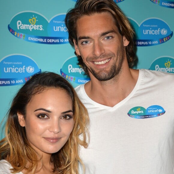 Camille Lacourt et sa femme Valérie Bègue sont les parrain et marraine du 10ème anniversaire du partenariat entre Pampers et l'Unicef pour le vaccin des enfants contre le tétanos, organisé à Paris le 13 novembre 2015.