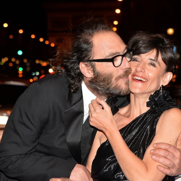 Romane Bohringer et son compagnon Philippe Rebbot lors de la 10ème cérémonie des Globes de Cristal au Lido à Paris, le 13 avril 2015.