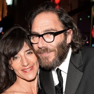 Romane Bohringer et son compagnon Philippe Rebbot lors de la 10ème cérémonie des Globes de Cristal au Lido à Paris, le 13 avril 2015.