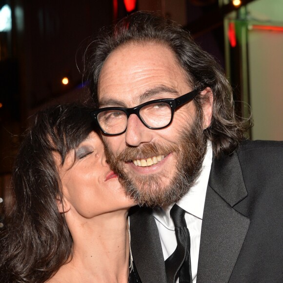 Romane Bohringer et son compagnon Philippe Rebbot lors de la 10ème cérémonie des Globes de Cristal au Lido à Paris, le 13 avril 2015.