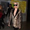 Lady Gaga à l'aéroport Roissy-Charles-de-Gaulle à Roissy, porte une veste (collection masculine automne-hiver 2016), un jean et des bottines Saint Laurent. Le 27 novembre 2016.
