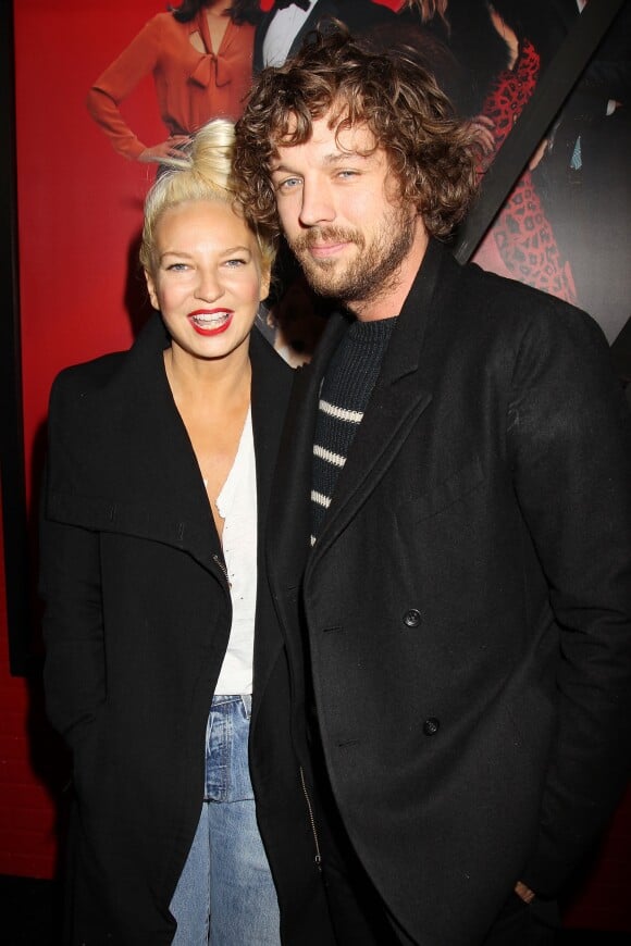 Sia et Erik Anders Lang assistent à la première mondiale du film "Annie" organisée au Ziegfeld Theater de New York, le 7 décembre 2014.