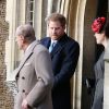 Le duc d'Edimbourg suivi par ses petits-enfants le prince Harry et la princesse Eugenie à la sortie de la messe de Noël en l'église St Mary à Sandringham (Norfolk) le 25 décembre 2016.